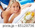 Young beautiful woman in spa environment 65120736