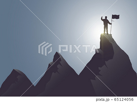 Silhouette of man standing on top of the mountain with flag with fist raised up on sunrise background 65124056