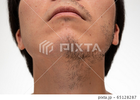 顔半分だけ髭を剃ったイメージの写真素材