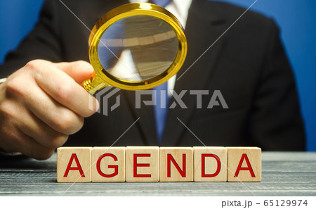Wooden blocks with the word Agenda and businessman. List of questions at the meeting. Business planning concept Wooden blocks with the word Agenda and businessman. List of questions at the meeting. Business planning concept 65129974
