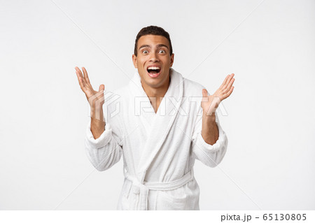 Hurray and cheers. Portrait of handsome shirtless young african american man looking excited while standing against white background Hurray and cheers. Portrait of handsome shirtless young african american man looking excited while standing against white background 65130805