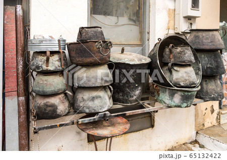 Several old cauldrons in heap 65132422