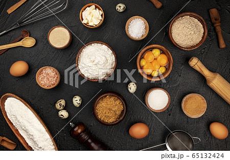 Baking ingredients pattern on black background, top view 65132424