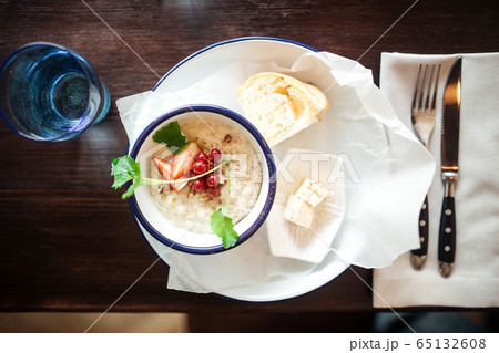 Served delicious breakfast milk porridge berries Served delicious breakfast milk porridge berries 65132608