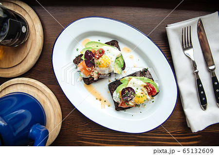 Breakfast rye toast with avocado poched egg salmon 65132609