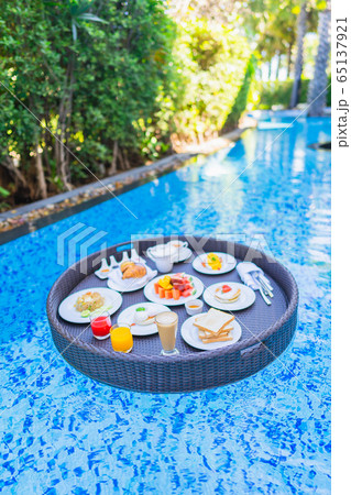Floating breakfast set in tray with fried egg omelette sausage ham bread fruit milk juice coffee Floating breakfast set in tray with fried egg omelette sausage ham bread fruit milk juice coffee 65137921