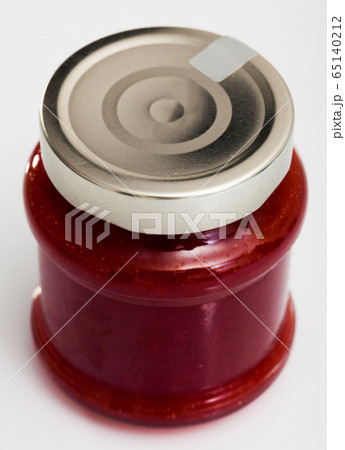 Strawberry jam in a glass jar 65140212