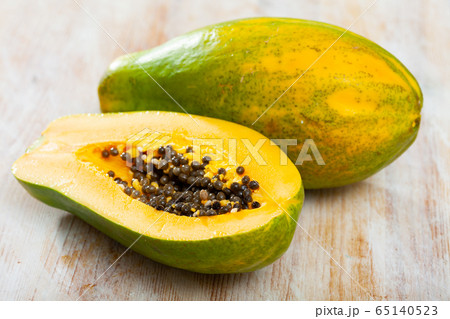 Papaya fruit on wooden table Papaya fruit on wooden table 65140523