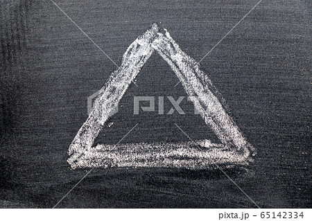 White color chalk hand drawing in triangle shape White color chalk hand drawing in triangle shape 65142334