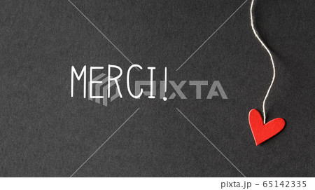 Merci - Thank you in French language with paper hearts Merci - Thank you in French language with paper hearts 65142335
