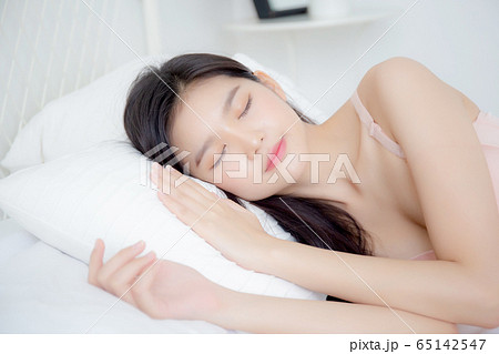 Beautiful asian young woman in underwear sleep lying on bed with comfort and happy leisure 65142547