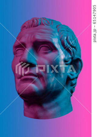 Statue of Guy Julius Caesar Octavian Augustus. Creative concept colorful neon image with ancient roman sculpture Guy Julius Caesar Octavian Augustus head. Cyberpunk, vaporwave and surreal art style. 65147905