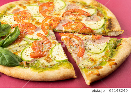 pizza close-up, isolated, against a colored background. whole pizza pizza close-up, isolated, against a colored background. whole pizza 65148249