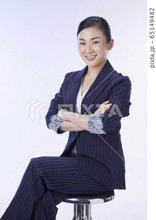 Concept Business woman. Portrait of attractive businesswoman sitting on the chair. 65149482
