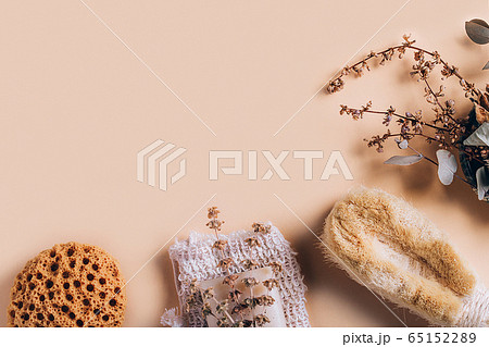 Natural spa and skincare beauty cleansing products with bathroom accessories including natural sponge, pumice stone and soap with seashells. 65152289
