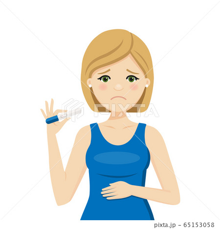 Woman with a negative pregnancy test result 65153058