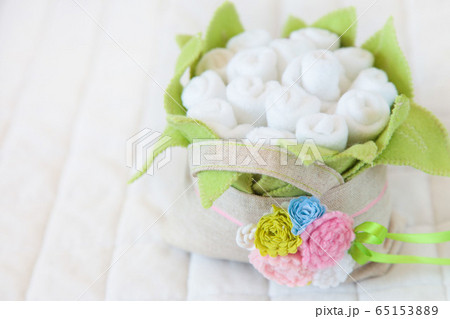 Handmade toy. flowers basket of textiles, fabrics and yarn. Flowers basket sewn by hand. Copy space 65153889