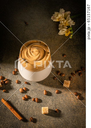 Homemade dalgona coffee. Trendy fluffy creamy whipped drink made by instant coffee, sugar and milk 65157167