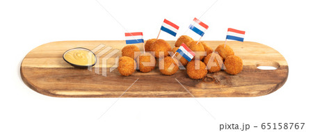 Dutch traditional snack bitterbal on a serving 65158767