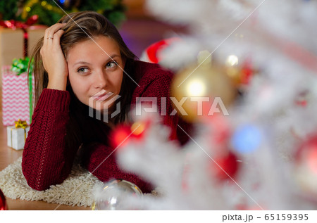 portrait of a beautiful brooding girl behind a 65159395