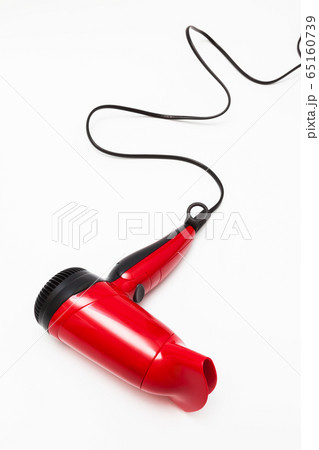 beautiful red hair dryer on white background 65160739