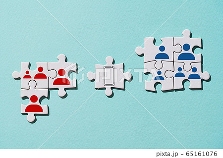 Puzzle pieces as example of stopping the spread of virus with help online communication. 65161076
