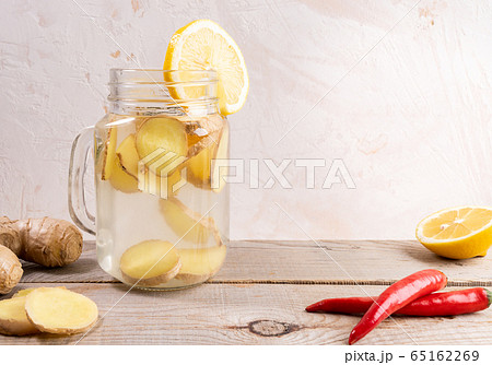 Glass jar full with ginger water and spises on Glass jar full with ginger water and spises on 65162269