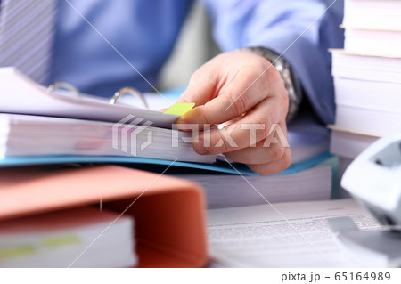 Man having deadline and working hard Man having deadline and working hard 65164989