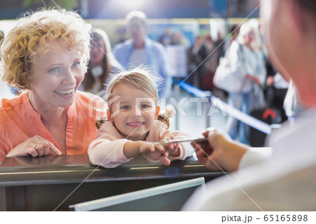 Portrait of mature woman carrying her cute little Portrait of mature woman carrying her cute little 65165898