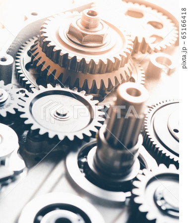 gears industrial background with warm shiny light gears industrial background with warm shiny light 65166418