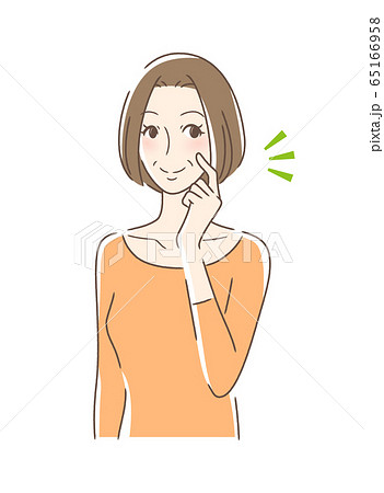 頬をつんつんして笑顔の女性 頬をつんつんして笑顔の女性 65166958