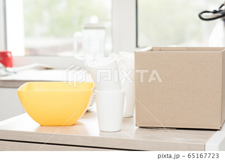 Donation box with food on a light interior background. 65167723