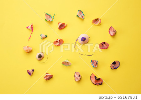 Color pencils shavings on yellow as creative background. Back to school concept 65167831
