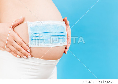 banner of medical mask on the belly of a pregnant banner of medical mask on the belly of a pregnant 65168521