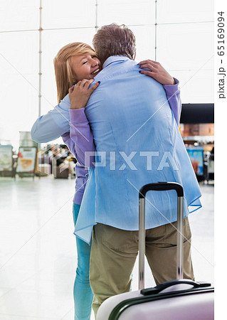 Portrait of mature man reuniting with his daughter Portrait of mature man reuniting with his daughter 65169094