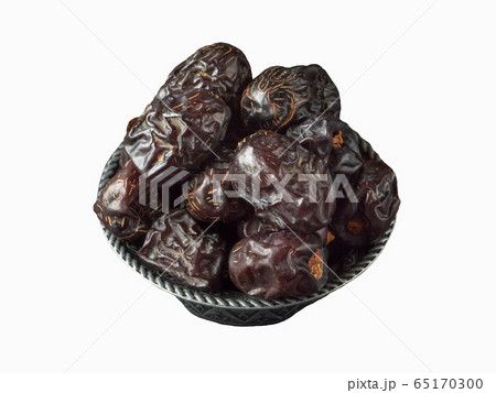 Isolated Saudi Ajwa dates in a bowl. Top view 65170300