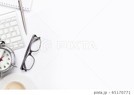 Workplace with computer, supplies and alarm clock 65170771