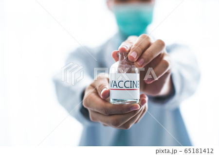 A doctor or scientist in laboratory holding a A doctor or scientist in laboratory holding a 65181412