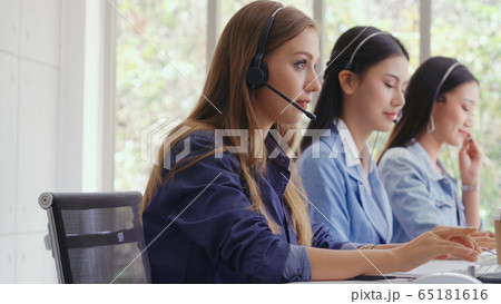 Customer support agent or call center with headset Customer support agent or call center with headset 65181616