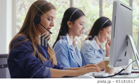 Customer support agent or call center with headset 65181617