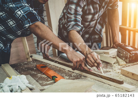 Carpenter working on wood craft at workshop Carpenter working on wood craft at workshop 65182143