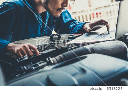 Professional mechanic providing car repair service Professional mechanic providing car repair service 65182224