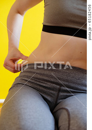 Healthcare concept, Fat overweight women pinching 65182456