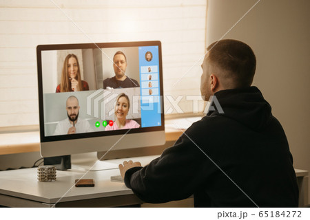 A man on an online briefing working from home. A man on an online briefing working from home. 65184272