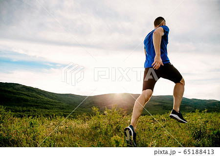 athlete runner run on mountain trail athlete runner run on mountain trail 65188413