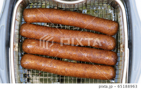 Frikadellen, a Dutch fast food snack in the oil 65188963
