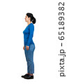 Full length side view of casual young woman 65189382