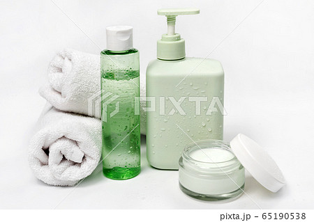 Cosmetic containers, blank label package for branding mock-up. Moisturizing cream, liquid soap or shampoo, tonic, face and body skin care. Natural green organic beauty product. 65190538