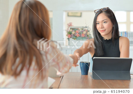 A portrait of a young businesswoman handshake A portrait of a young businesswoman handshake 65194070