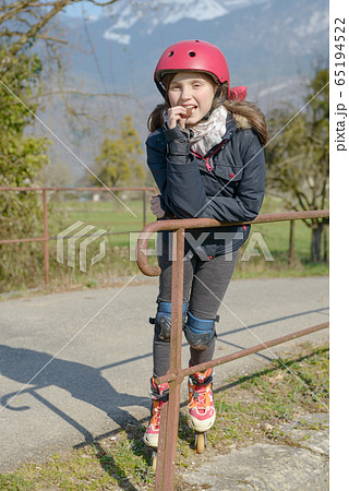preteen with roller skate helmet, eat a cake preteen with roller skate helmet, eat a cake 65194522